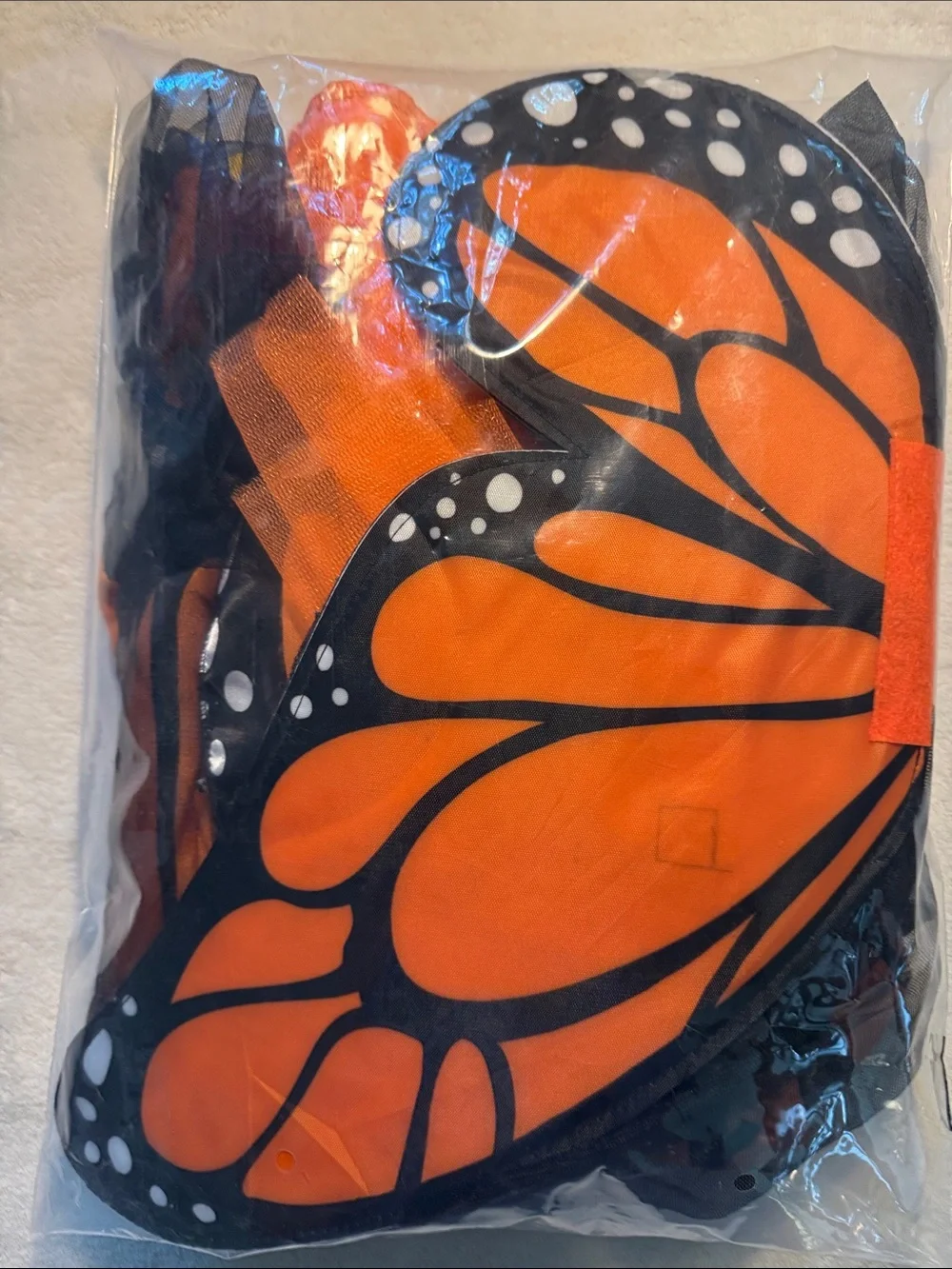 Halloween children’s orange and black monarch butterfly costume. Removable wings